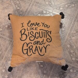 Decorative Tan Pillow with Black Text